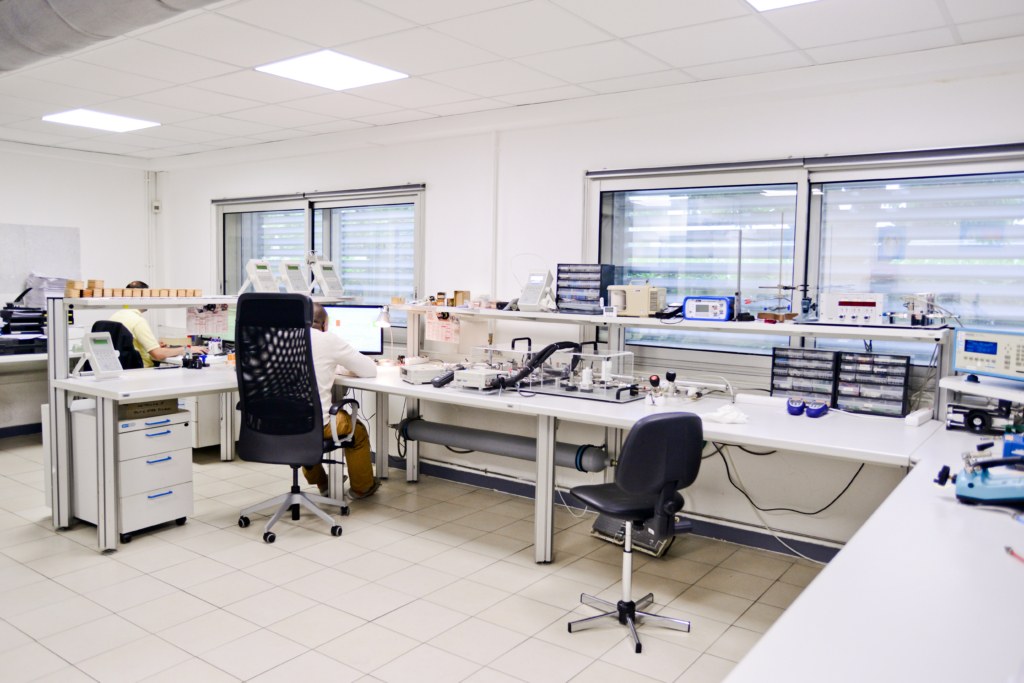 ATEQ engineers working together at laboratory instrument benches